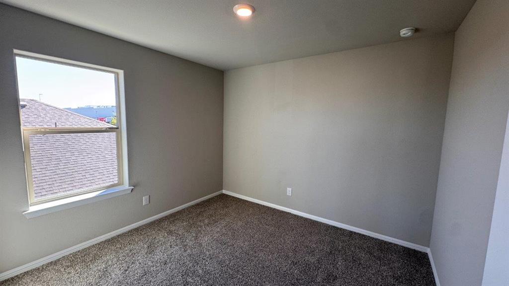 325 Wildrose Circle Cleburne, TX 76033 - Photo 17 of 24 an empty room with a window