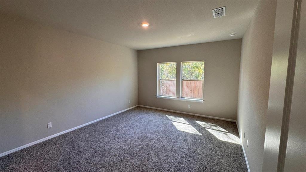 325 Wildrose Circle Cleburne, TX 76033 - Photo 4 of 24 an empty room with windows