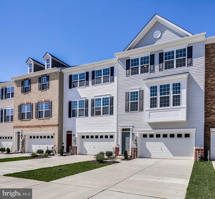 904 Morgan Run Road Baltimore, MD 21220 - Photo 1 of 23 a front view of a building with a yard