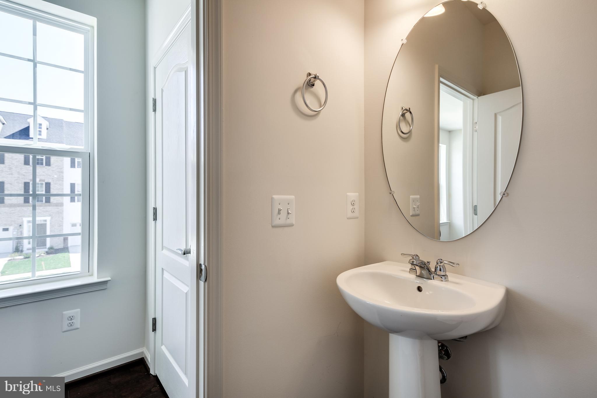 904 Morgan Run Road Baltimore, MD 21220 - Photo 11 of 23 a bathroom with a sink and a mirror