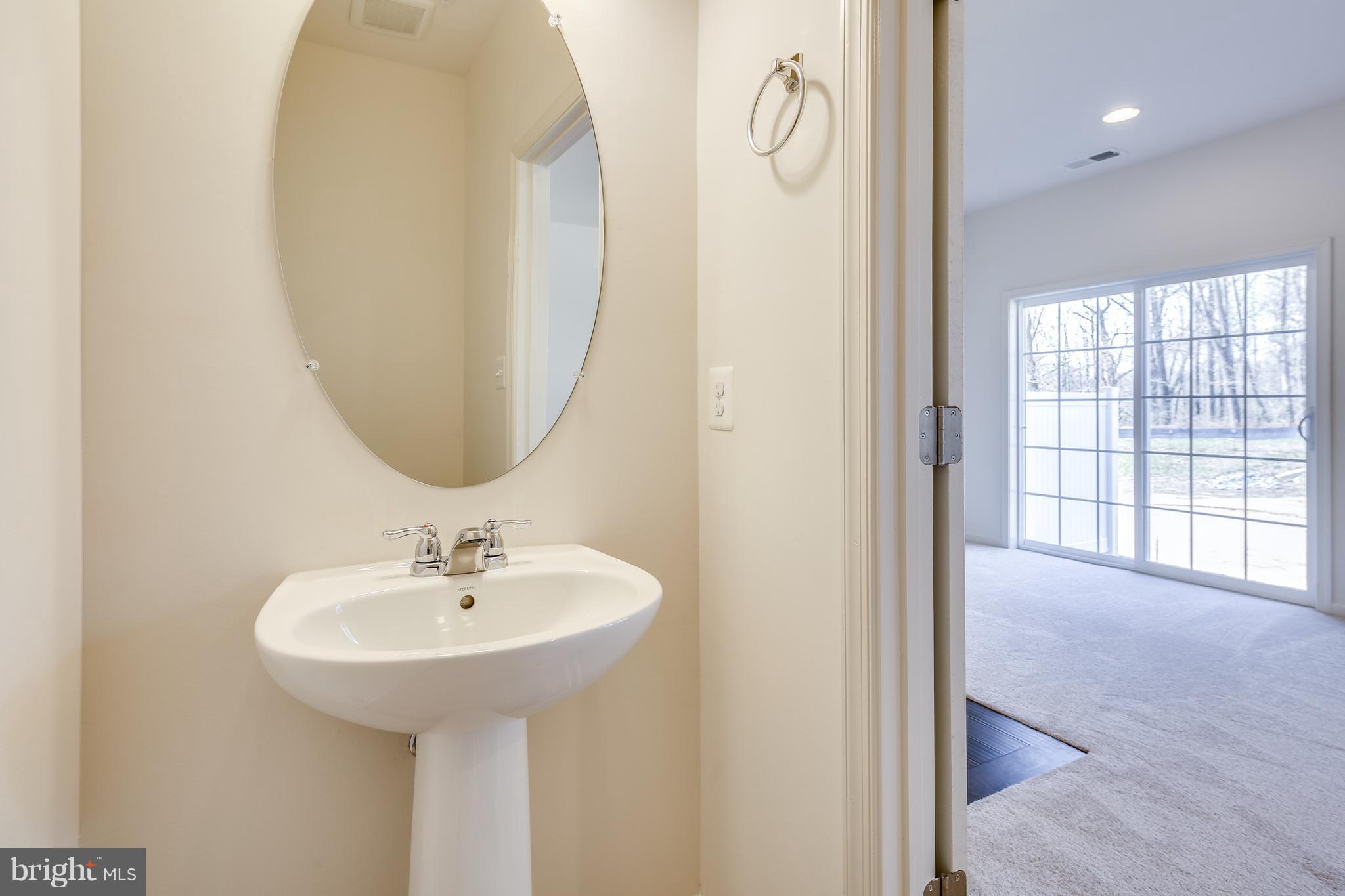 904 Morgan Run Road Baltimore, MD 21220 - Photo 12 of 23 a bathroom with a sink and a mirror