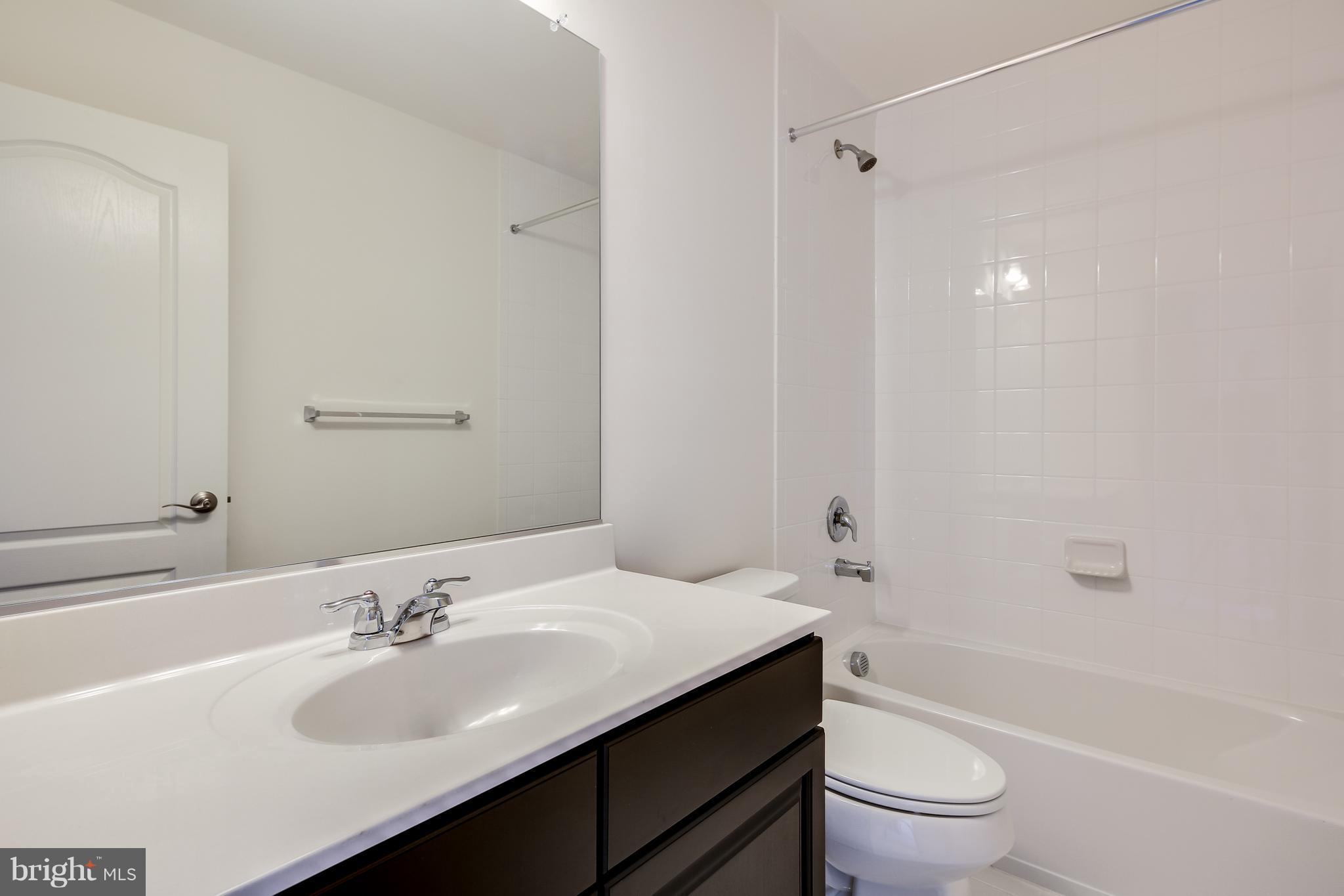 904 Morgan Run Road Baltimore, MD 21220 - Photo 13 of 23 a bathroom with a sink toilet tub and shower