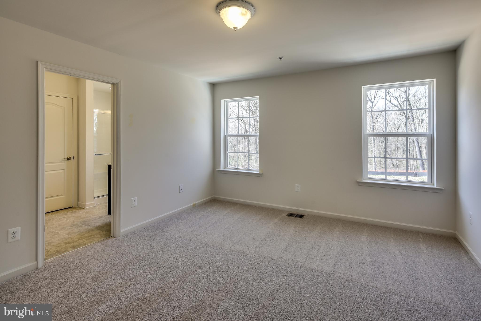 904 Morgan Run Road Baltimore, MD 21220 - Photo 16 of 23 an empty room with windows and closet