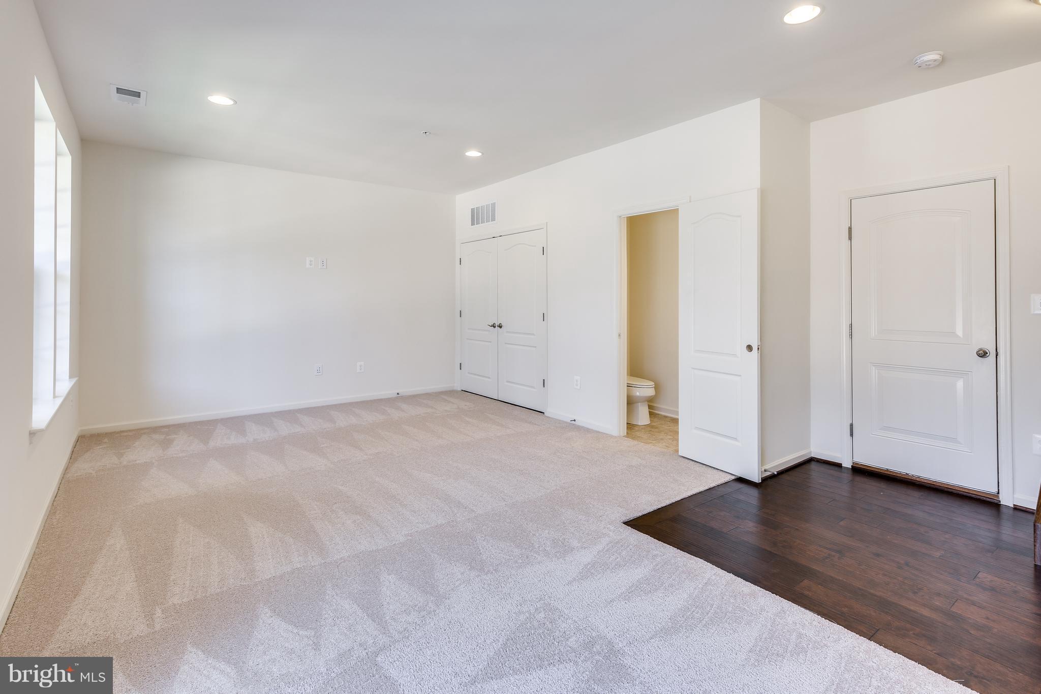 904 Morgan Run Road Baltimore, MD 21220 - Photo 4 of 23 an empty room with wooden floor and window