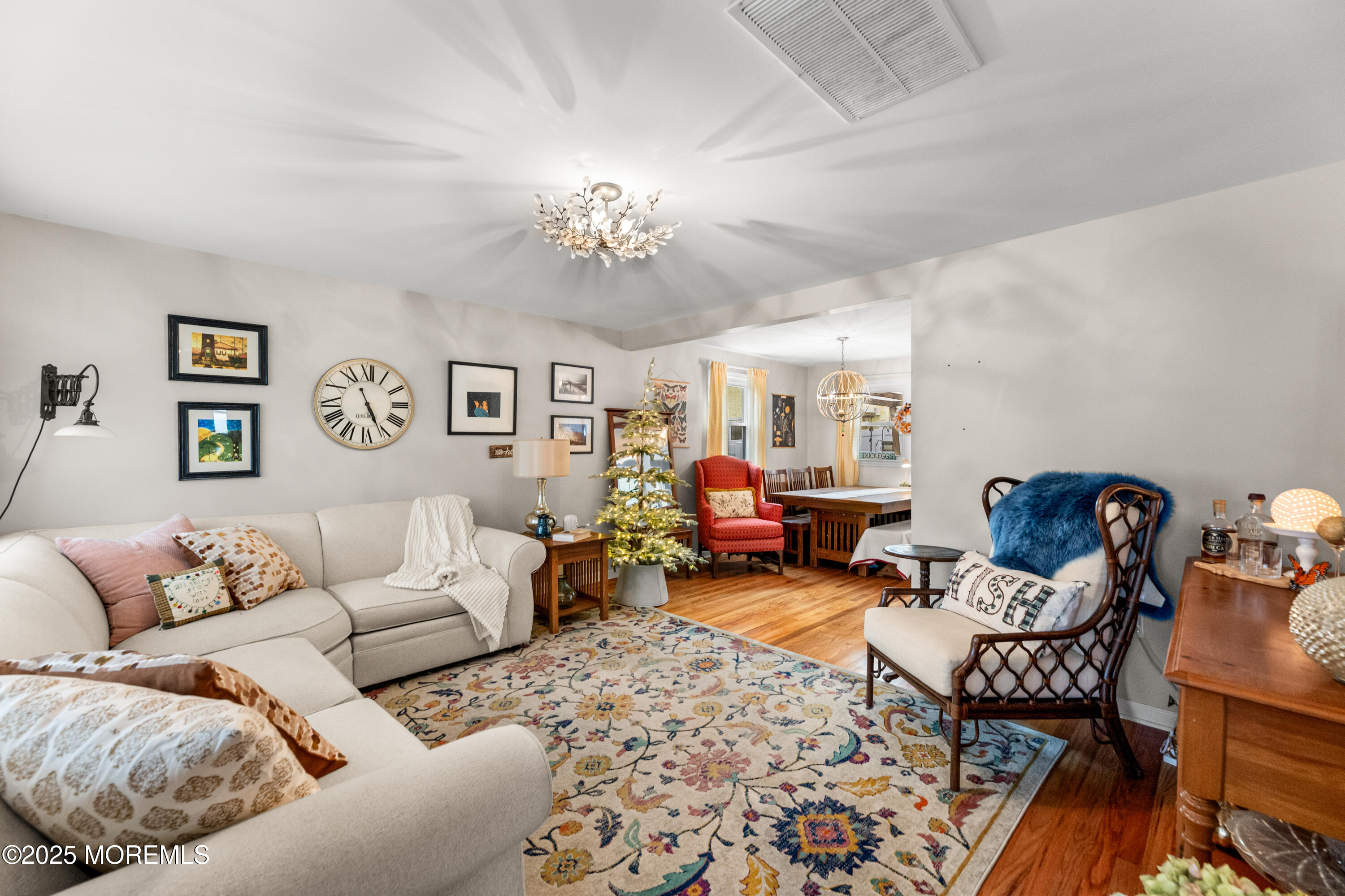 1609 Wight Street Wall, NJ 07719 - Photo 13 of 39 a living room with furniture and a chandelier