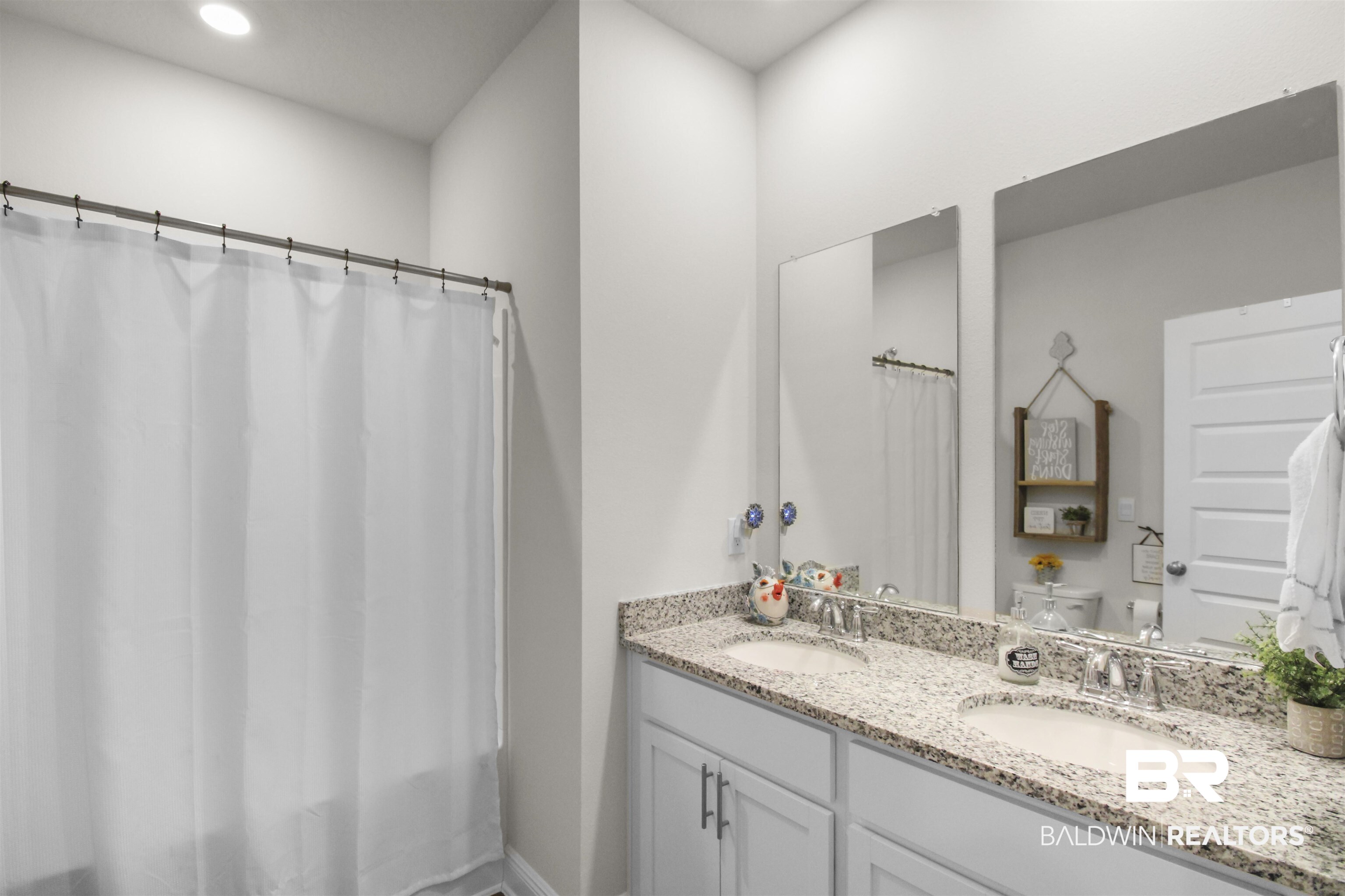 12523 Pheasant Run Elberta, AL 36530 - Photo 25 of 43 Full bathroom featuring double vanity, recessed lighting, and shower / bath combination with curtain