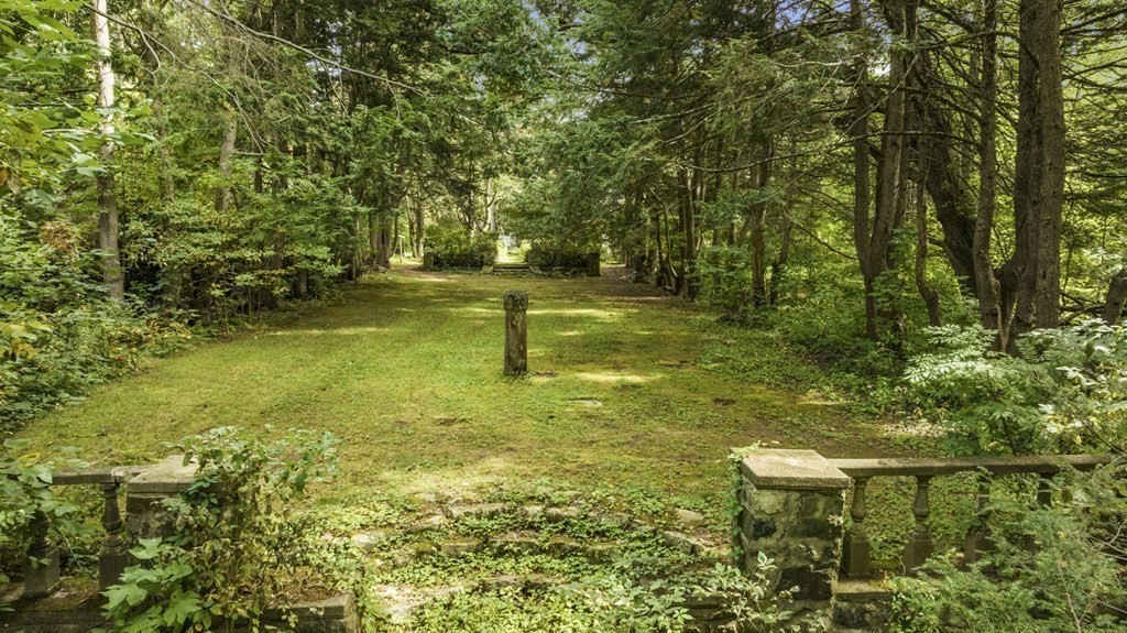 25 Plympton Road Sudbury, MA 01776 - Photo 12 of 19 a backyard of a house with lots of green space