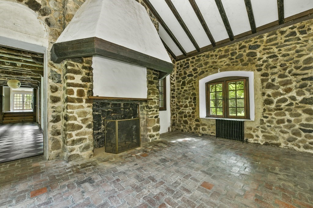 25 Plympton Road Sudbury, MA 01776 - Photo 17 of 19 a view of front door of house with wooden door