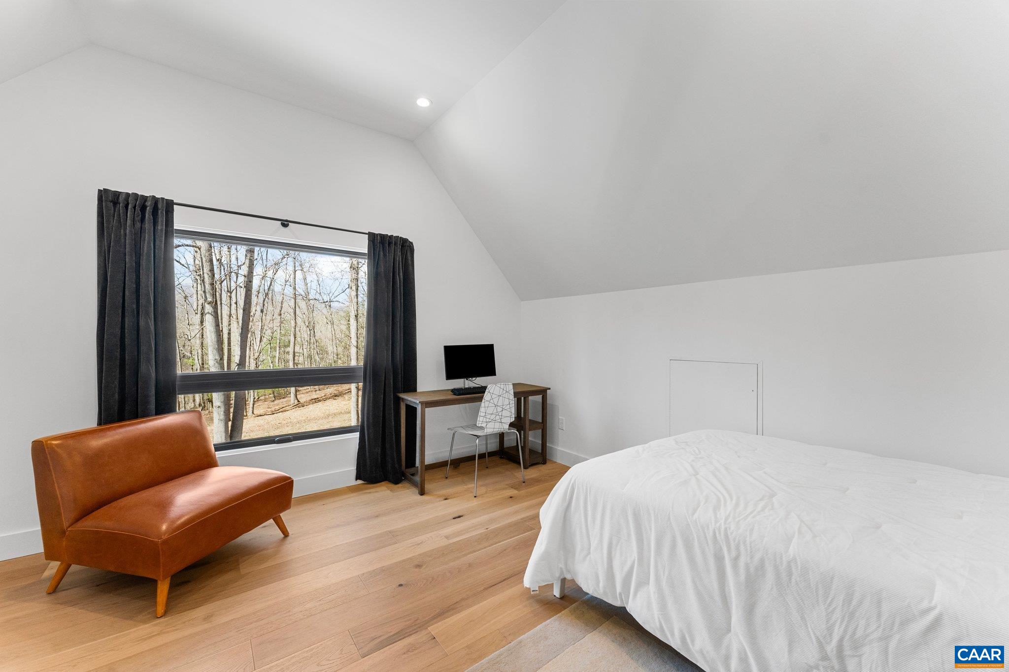 6500 Free Union Road Free Union, VA 22940 - Photo 18 of 35 a spacious bedroom with a bed and a large window