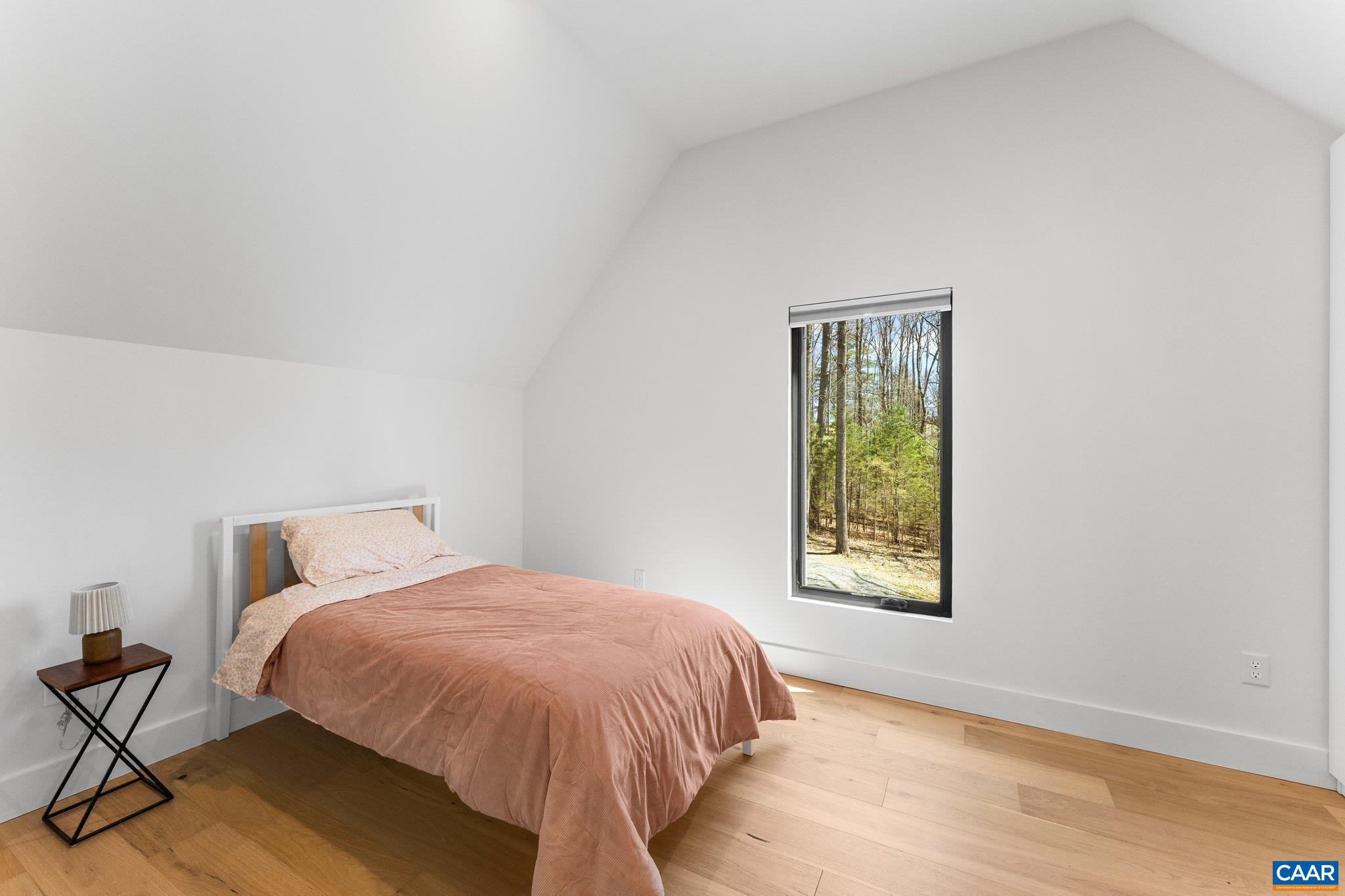 6500 Free Union Road Free Union, VA 22940 - Photo 20 of 35 a bed sitting in a bedroom next to a window