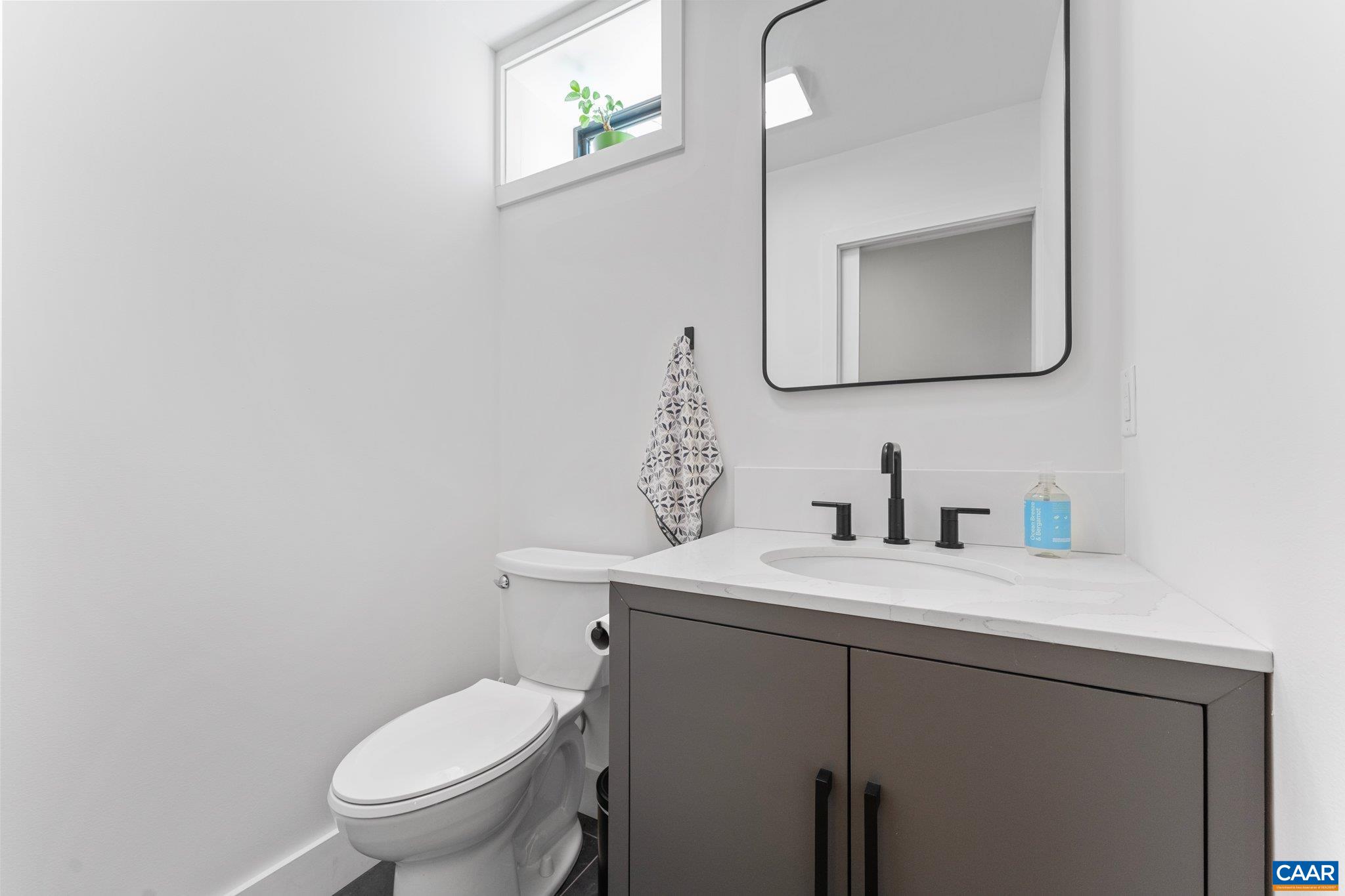 6500 Free Union Road Free Union, VA 22940 - Photo 29 of 35 a bathroom with a toilet sink vanity and mirror