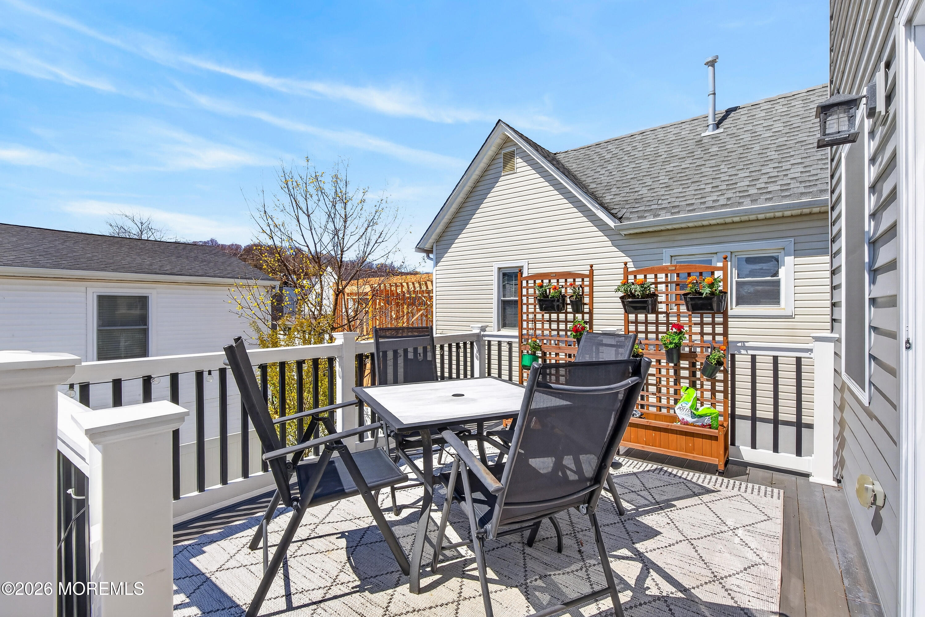 27 5th Street Highlands, NJ 07732 - Photo 57 of 62 a view of a chairs and table in the balcony