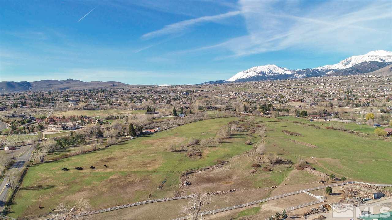 11345 Thomas Creek Road Reno, NV 89511 - Photo 12 of 12 a view of a lake with mountains in the background
