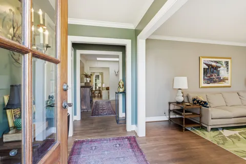 a living room with furniture and a rug