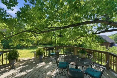 a view of a chairs and table on the deck
