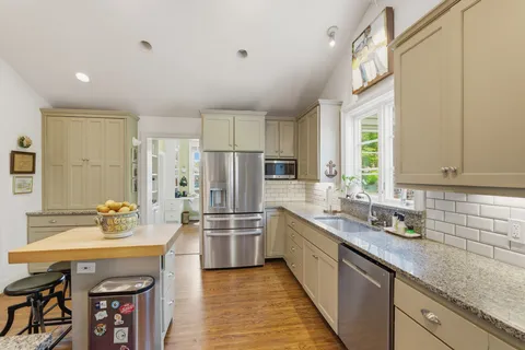 a kitchen with refrigerator a sink and dishwasher