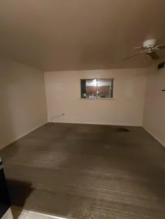 an empty room with wooden floor