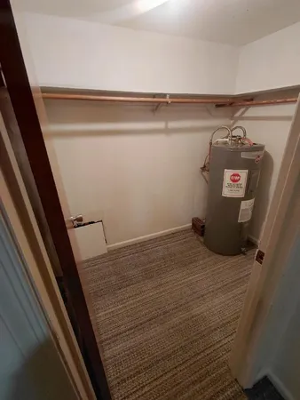 a bathroom with a sink and washing machine in it