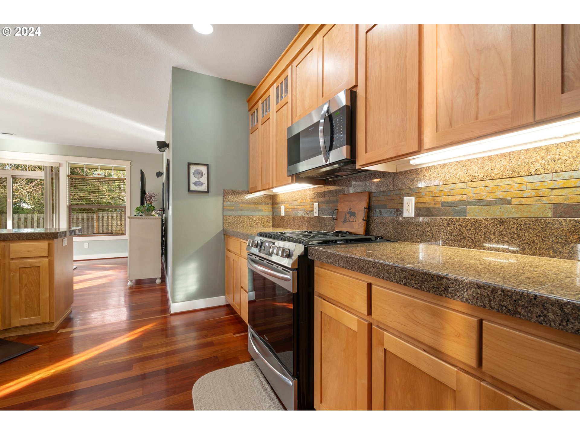 941 Northwest Angel Heights Road Stevenson, WA 98648 - Photo 20 of 38 a kitchen with stainless steel appliances granite countertop a stove a sink and a microwave