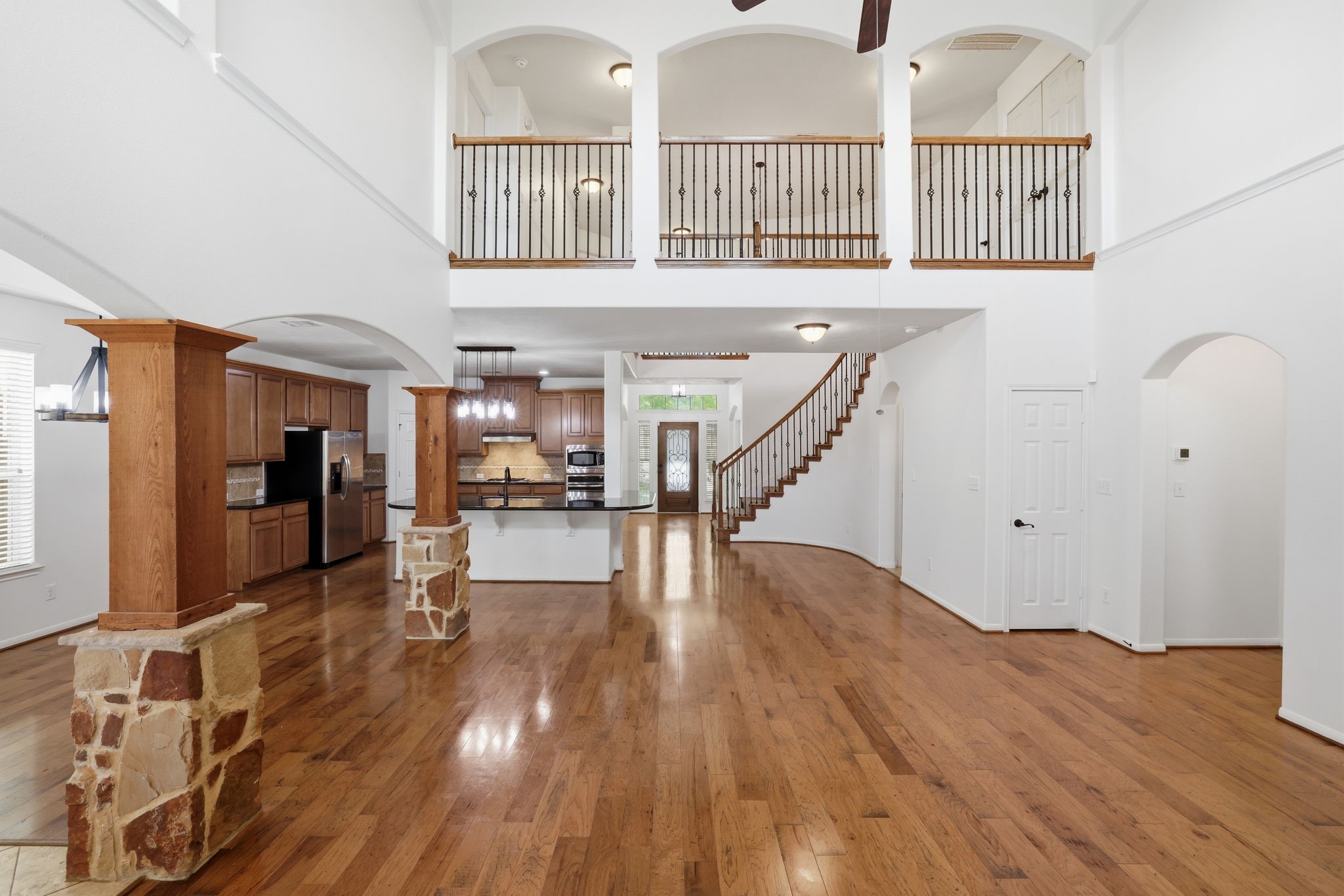 8169 Tranquil Lake Way Conroe, TX 77385 - Photo 5 of 26 a view of entryway and hall with wooden floor