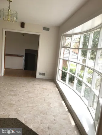 a view of a livingroom with furniture and front door