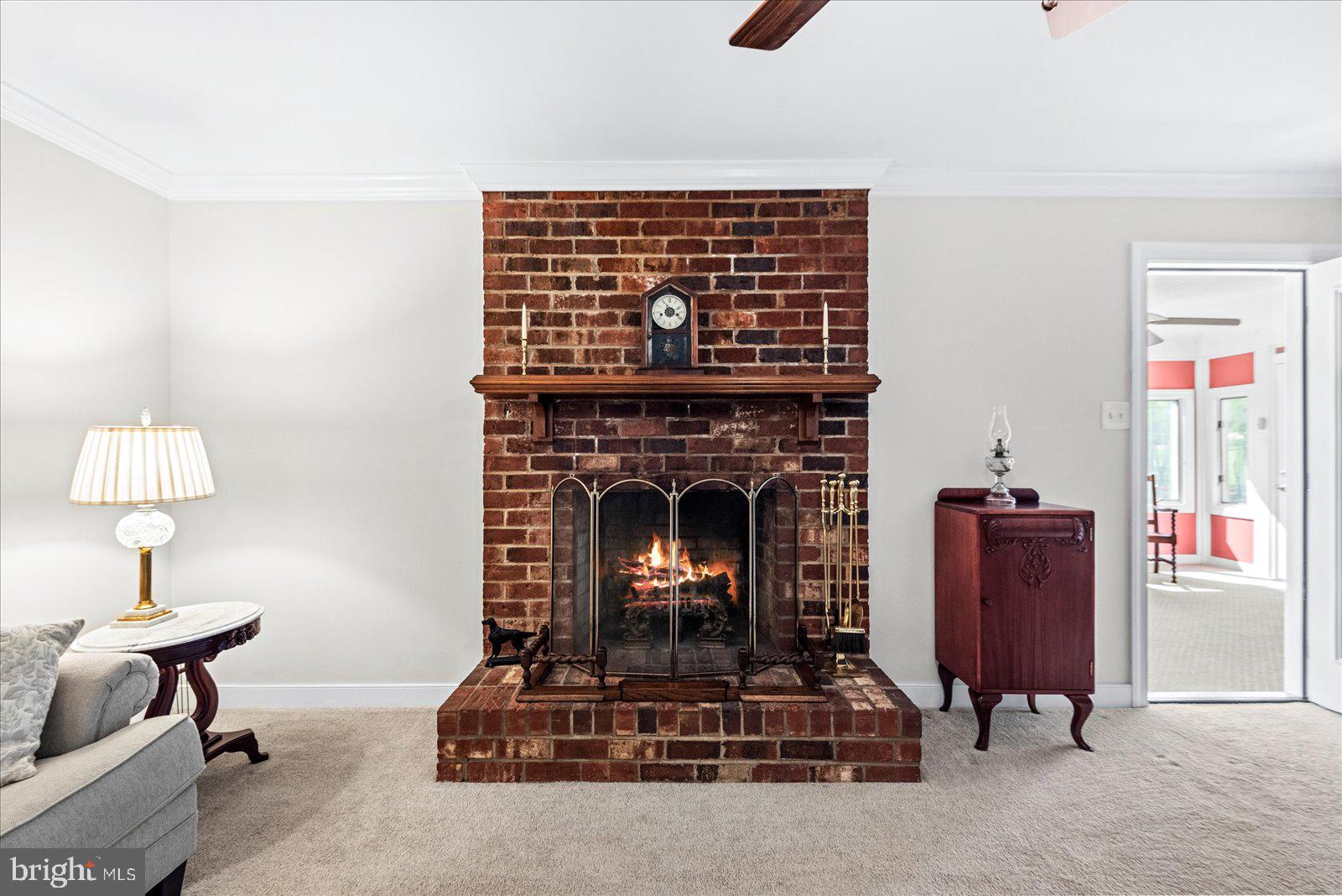 16211 Parrish Farm Road Montpelier, VA 23192 - Photo 20 of 52 Brick fireplace warms the space.