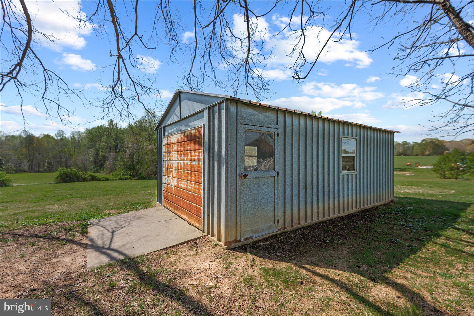 16211 Parrish Farm Road Montpelier, VA 23192 - Photo 42 of 52 Storage building amidst open fields.