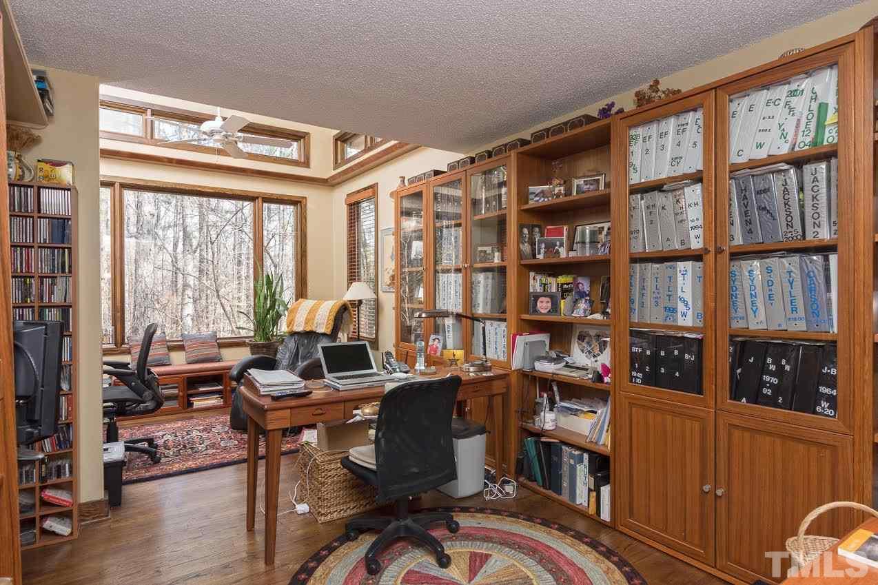 1500 Southview Road Durham, NC 27703 - Photo 13 of 22 a living room with furniture a bookshelf and a window