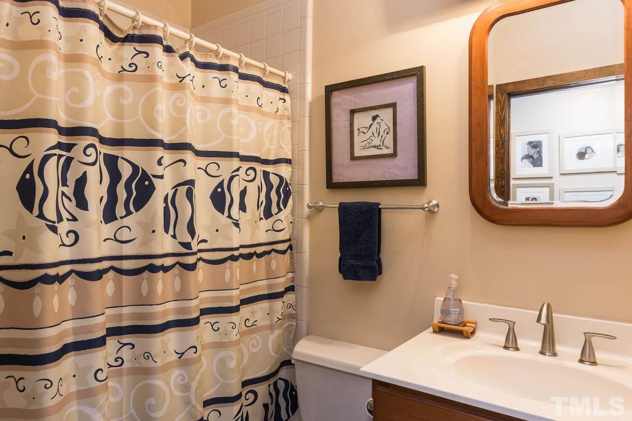 1500 Southview Road Durham, NC 27703 - Photo 18 of 22 a bathroom with a sink and a mirror