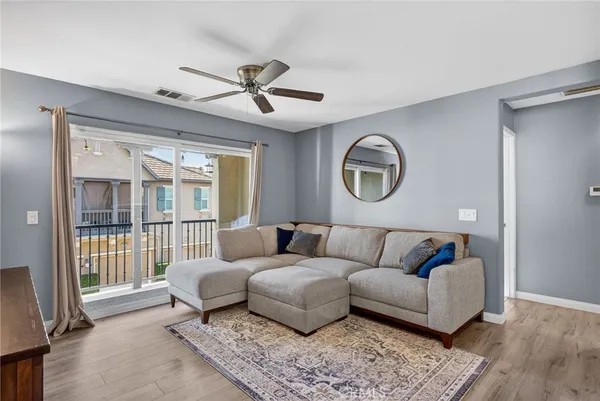 a living room with a couch and a window