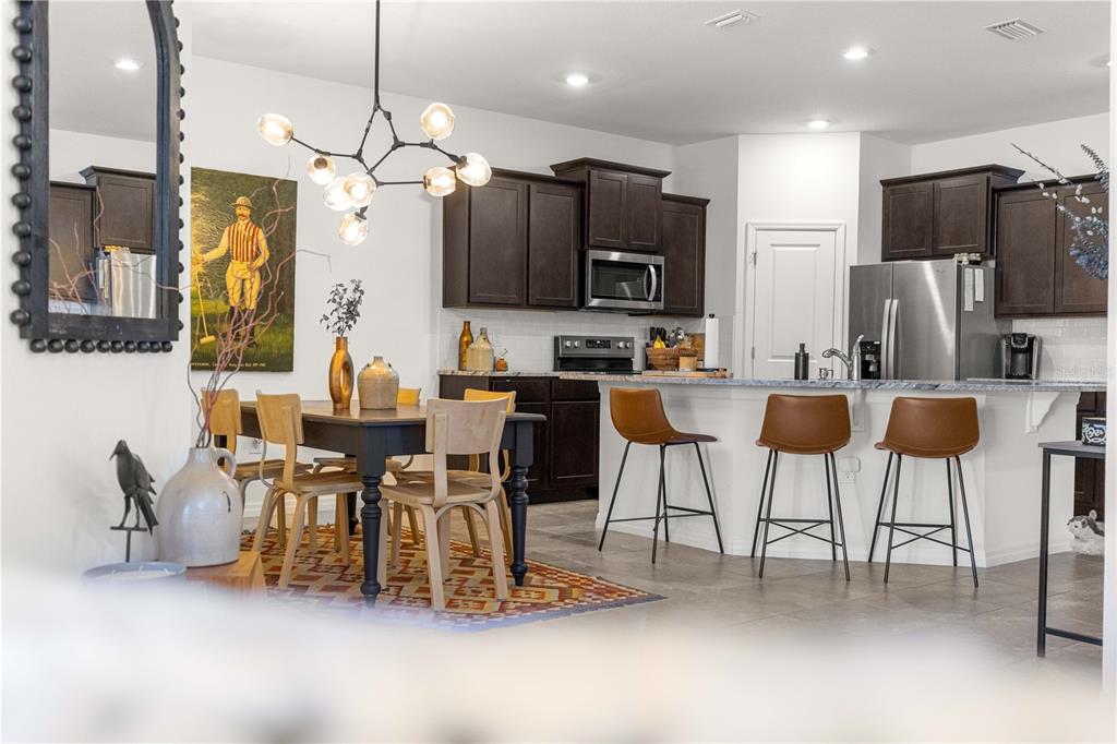 5377 Northwest 46th Lane Road Ocala, FL 34482 - Photo 14 of 59 a large kitchen with a table and chairs