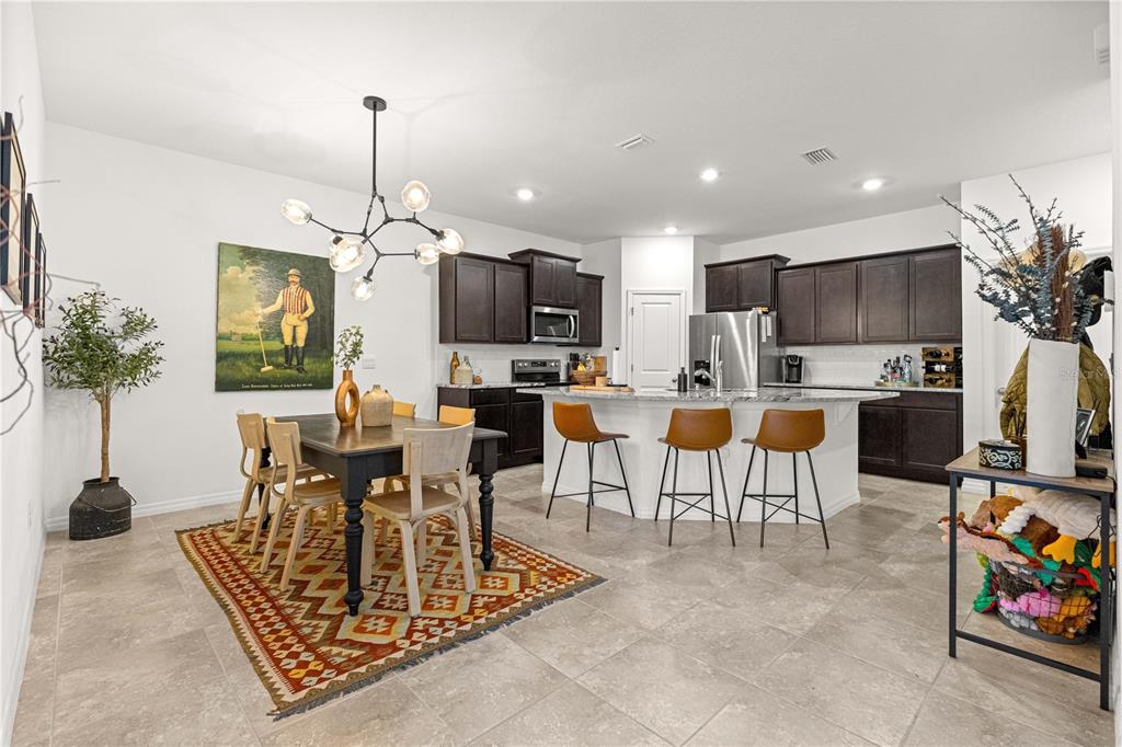 5377 Northwest 46th Lane Road Ocala, FL 34482 - Photo 15 of 59 a living room with fireplace furniture and a flat screen tv