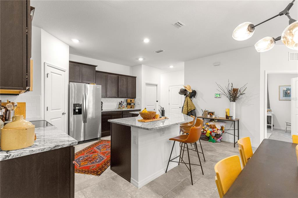 5377 Northwest 46th Lane Road Ocala, FL 34482 - Photo 20 of 59 a kitchen with refrigerator and cabinets
