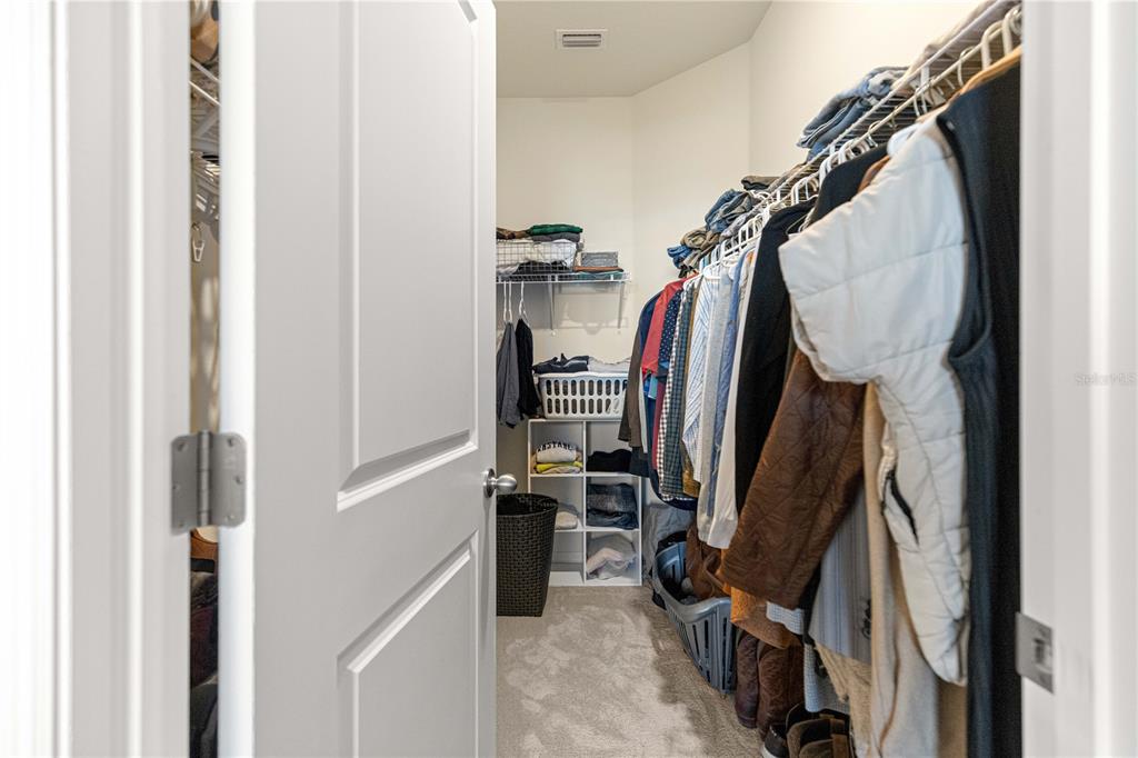 5377 Northwest 46th Lane Road Ocala, FL 34482 - Photo 26 of 59 a view of walk in closet with clothes and shoes
