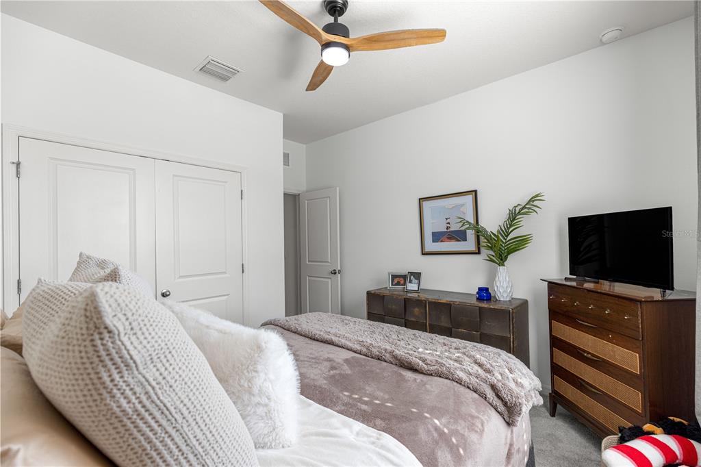 5377 Northwest 46th Lane Road Ocala, FL 34482 - Photo 33 of 59 a bedroom with a bed and a flat screen tv