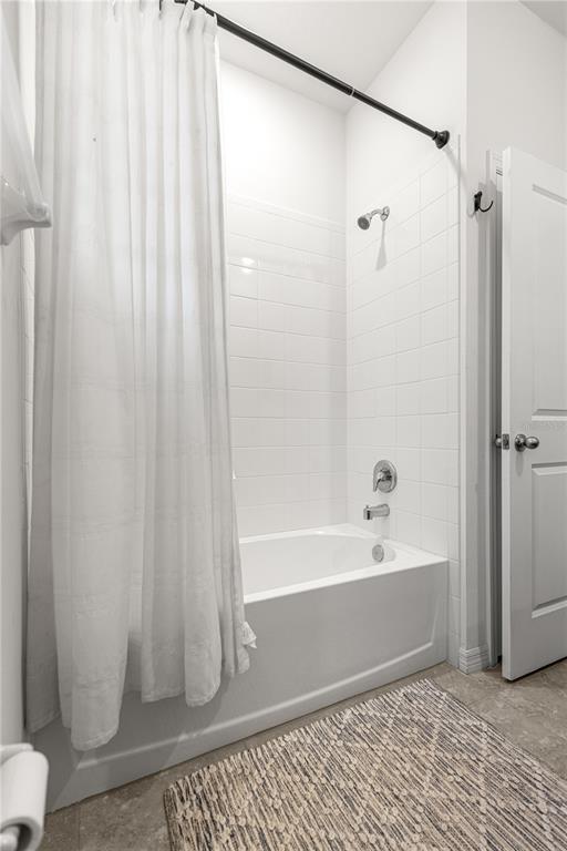 5377 Northwest 46th Lane Road Ocala, FL 34482 - Photo 35 of 59 a bathroom with a bathtub and a shower