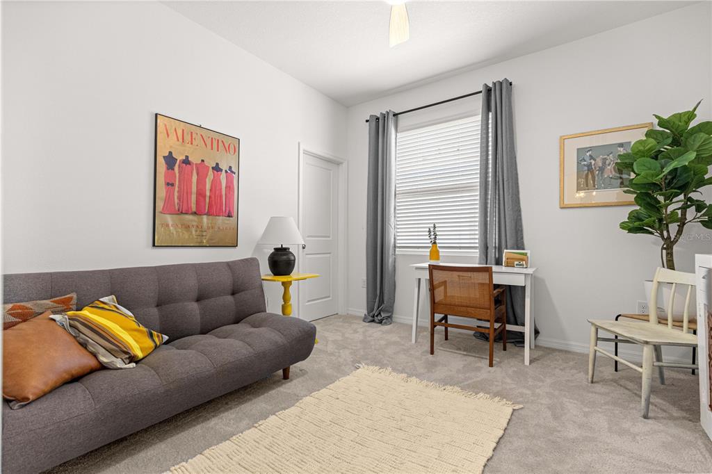 5377 Northwest 46th Lane Road Ocala, FL 34482 - Photo 38 of 59 a living room with furniture a potted plant and a window