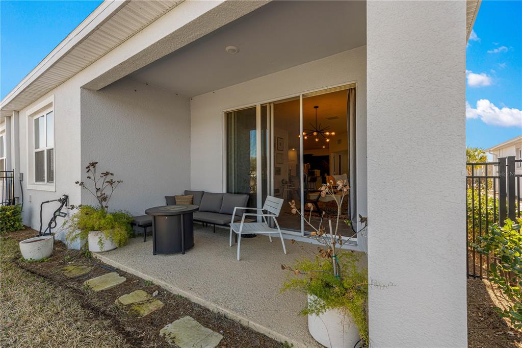 5377 Northwest 46th Lane Road Ocala, FL 34482 - Photo 42 of 59 a view of a patio with table and chairs
