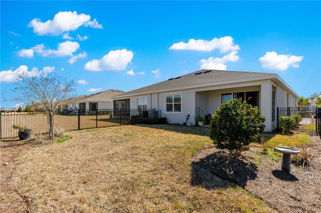 5377 Northwest 46th Lane Road Ocala, FL 34482 - Photo 44 of 59 a front view of a house with a yard