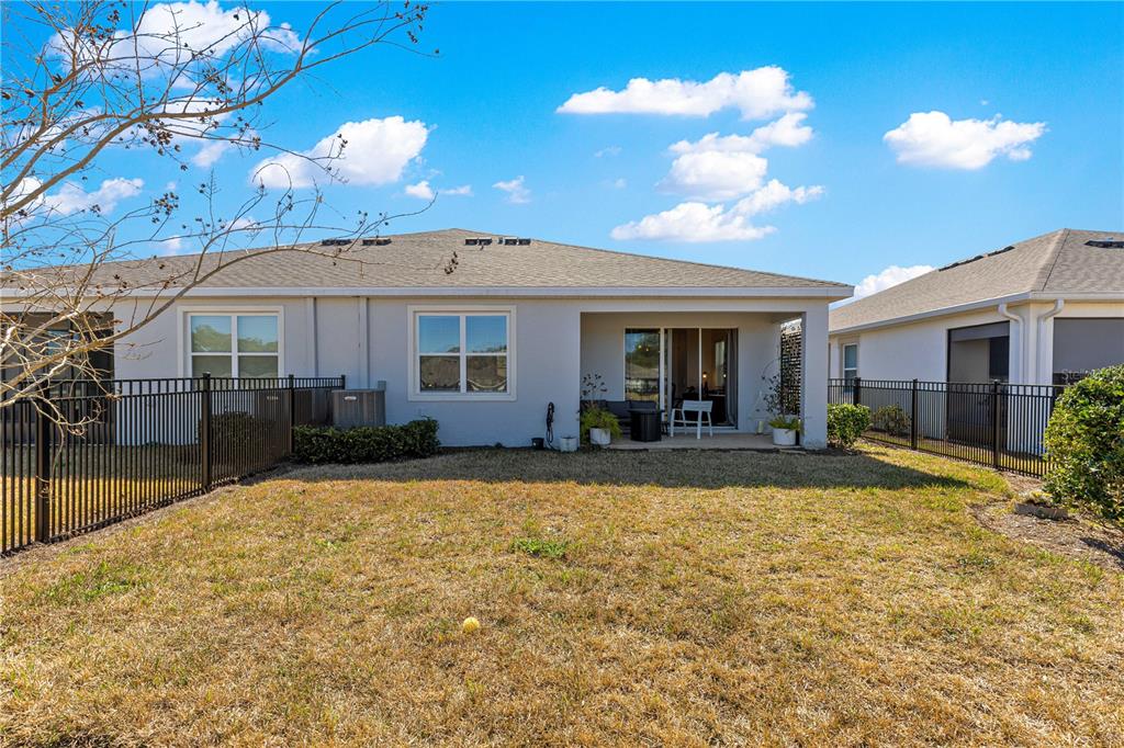 5377 Northwest 46th Lane Road Ocala, FL 34482 - Photo 45 of 59 a view of a house with backyard and sitting area