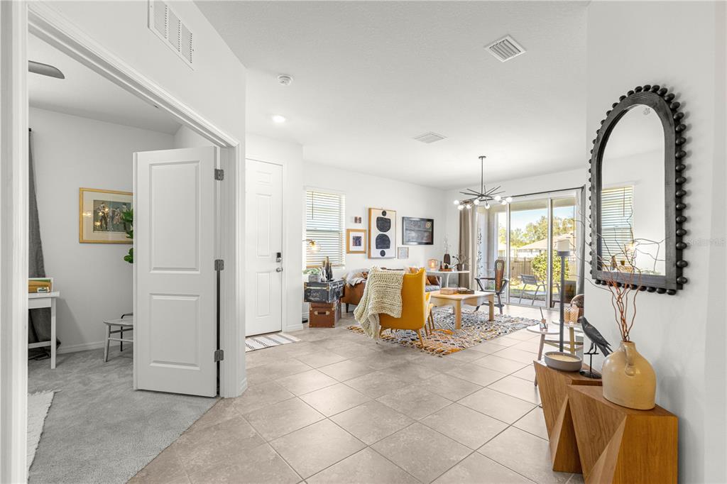 5377 Northwest 46th Lane Road Ocala, FL 34482 - Photo 5 of 59 a living room with furniture and white walls