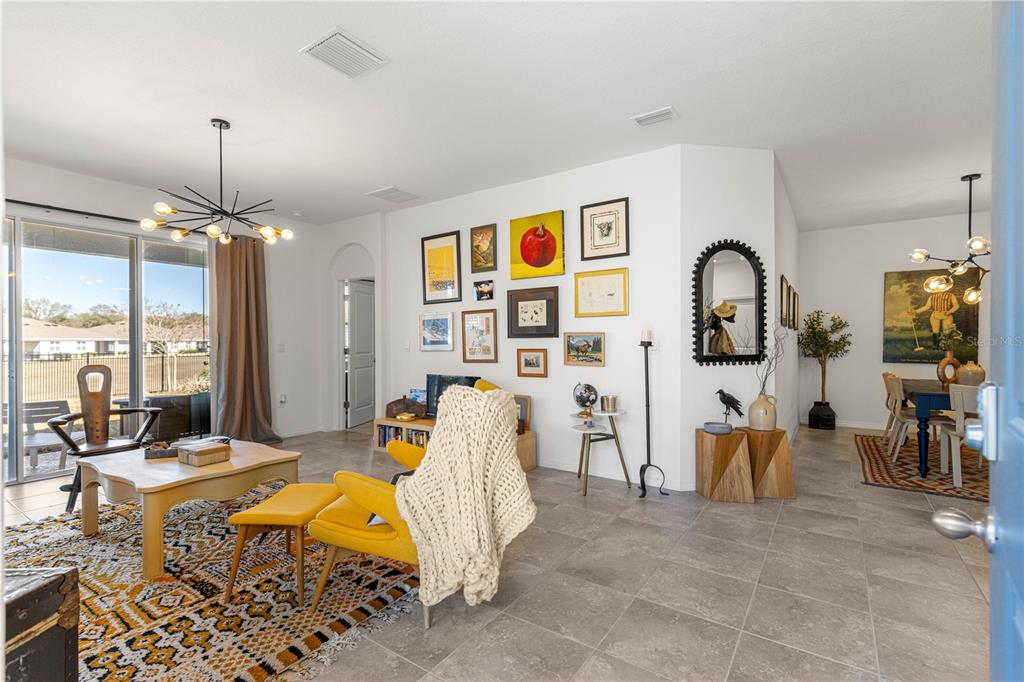 5377 Northwest 46th Lane Road Ocala, FL 34482 - Photo 8 of 59 a bedroom with furniture a ceiling fan a rug and a window