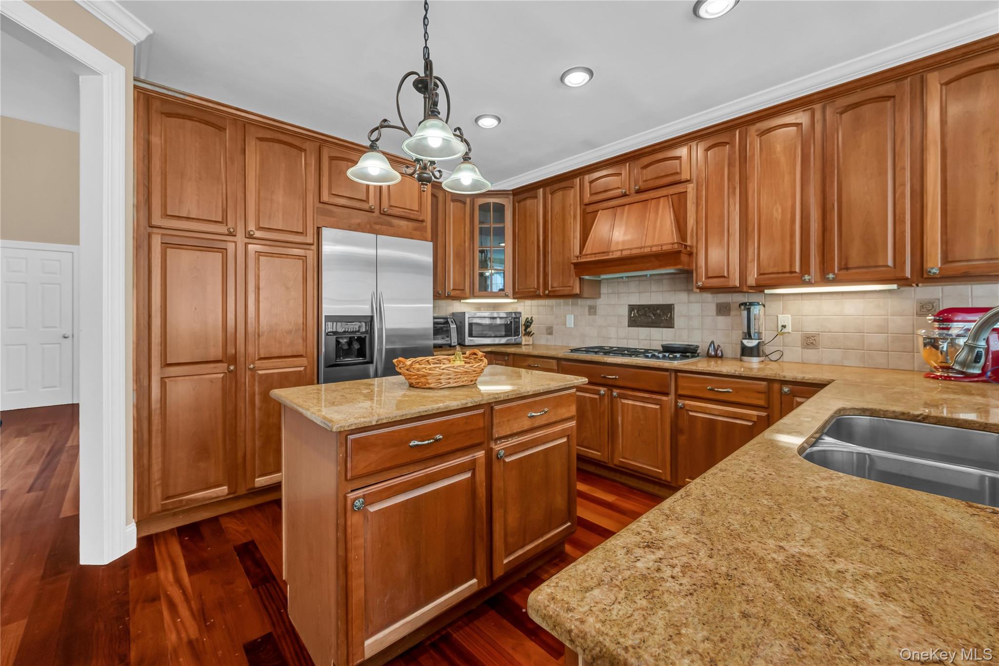 424 Gage Road Brewster, NY 10509 - Photo 12 of 42 a kitchen with stainless steel appliances granite countertop wooden cabinets a stove a sink and dishwasher