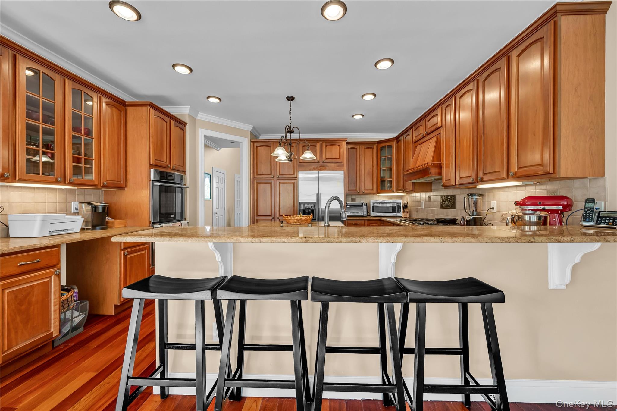 424 Gage Road Brewster, NY 10509 - Photo 14 of 42 a kitchen with a table chairs sink and cabinets