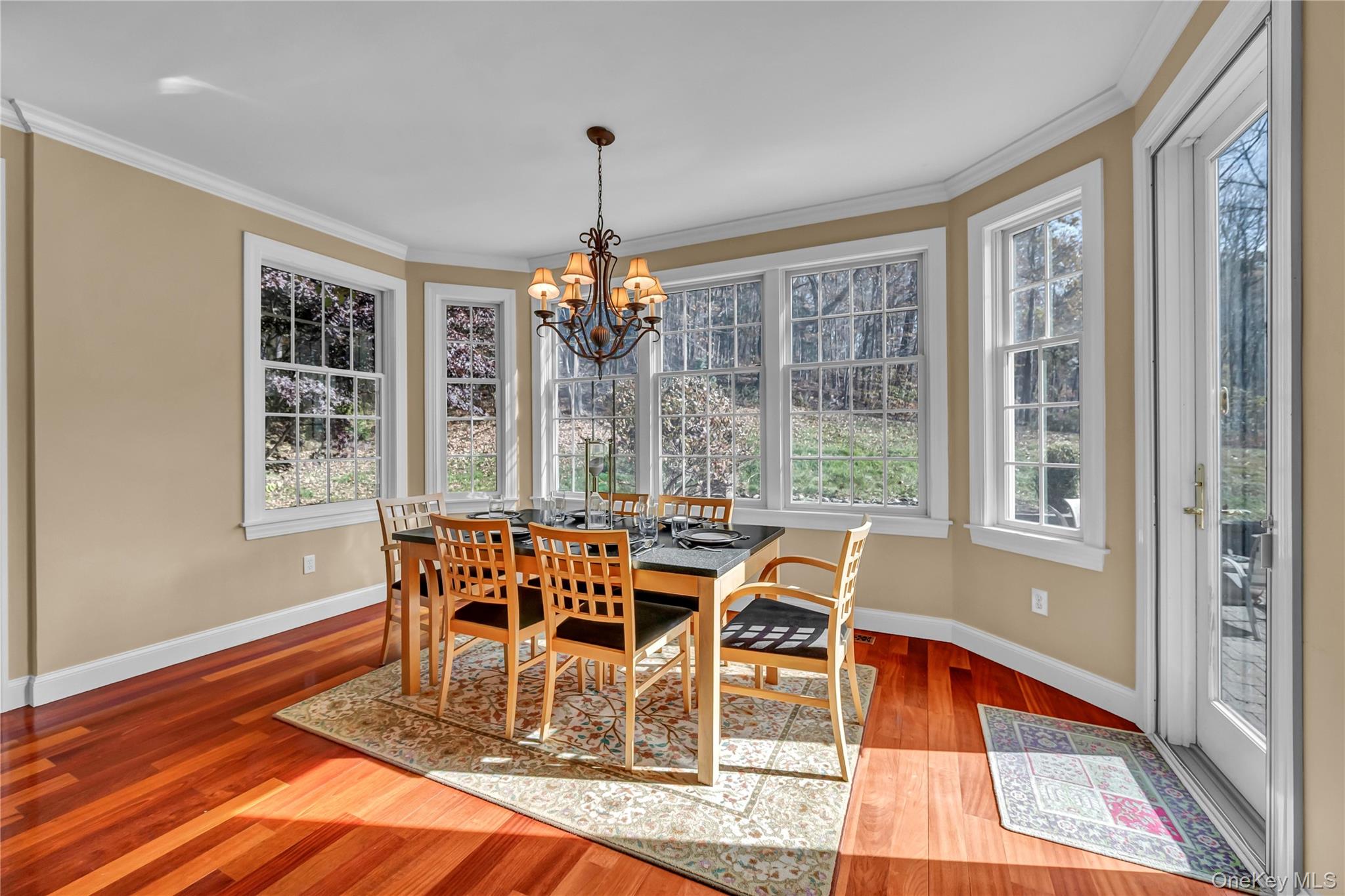 424 Gage Road Brewster, NY 10509 - Photo 18 of 42 a view of a dining room with furniture wooden floor and chandelier