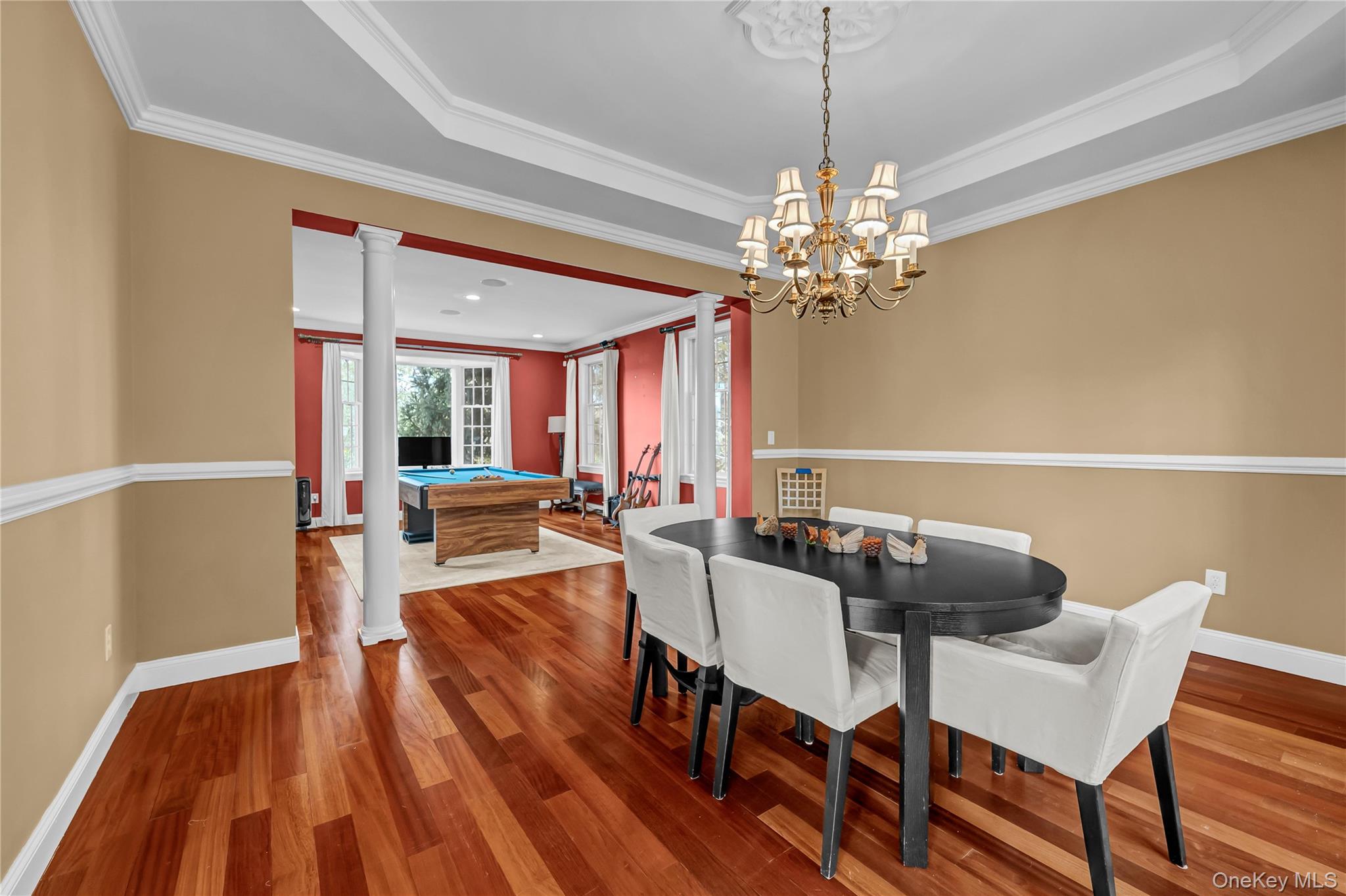 424 Gage Road Brewster, NY 10509 - Photo 20 of 42 a view of a dining room with furniture a chandelier and wooden floor