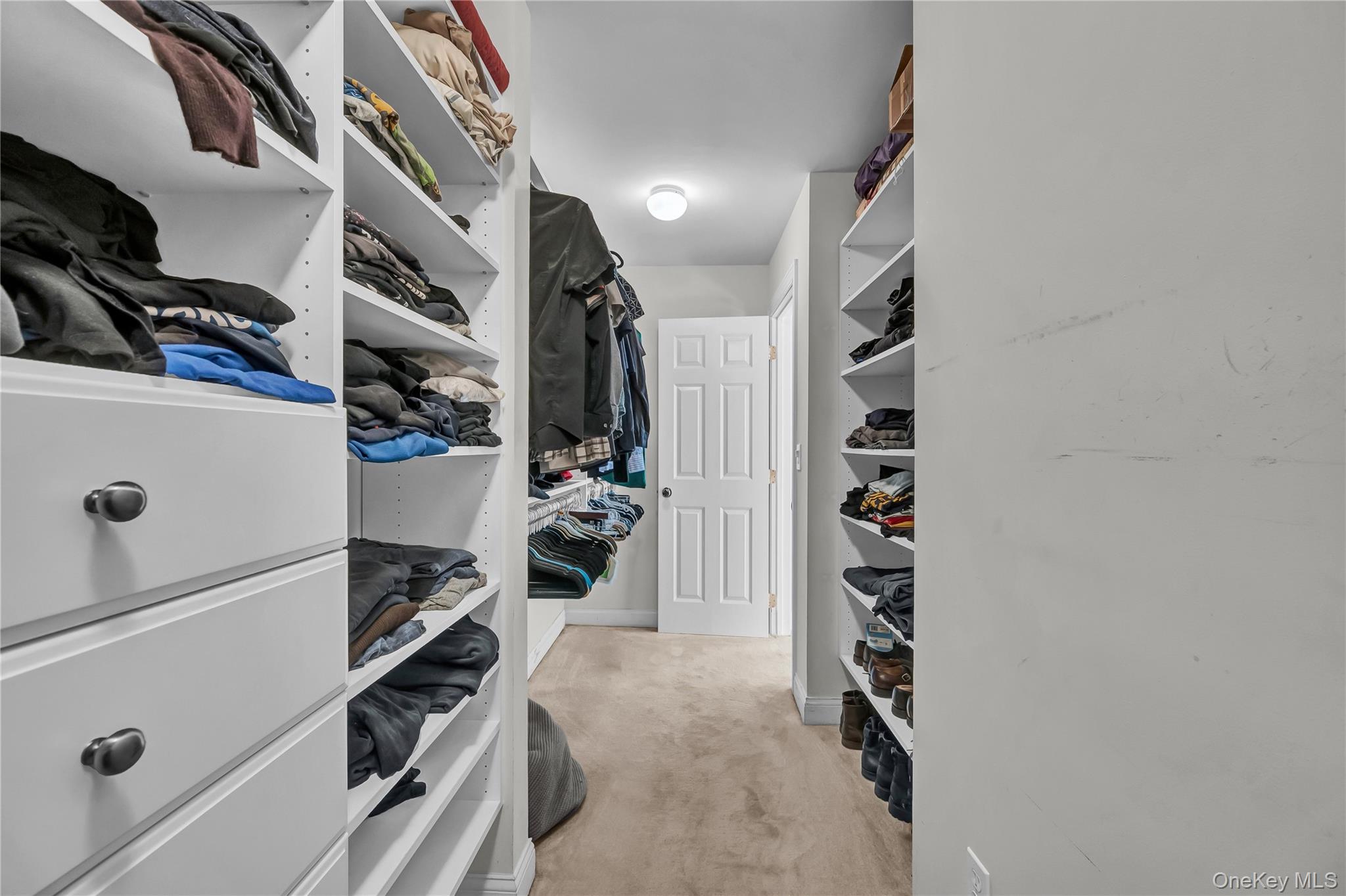 424 Gage Road Brewster, NY 10509 - Photo 28 of 42 a view of walk in closet with clothes and shoes