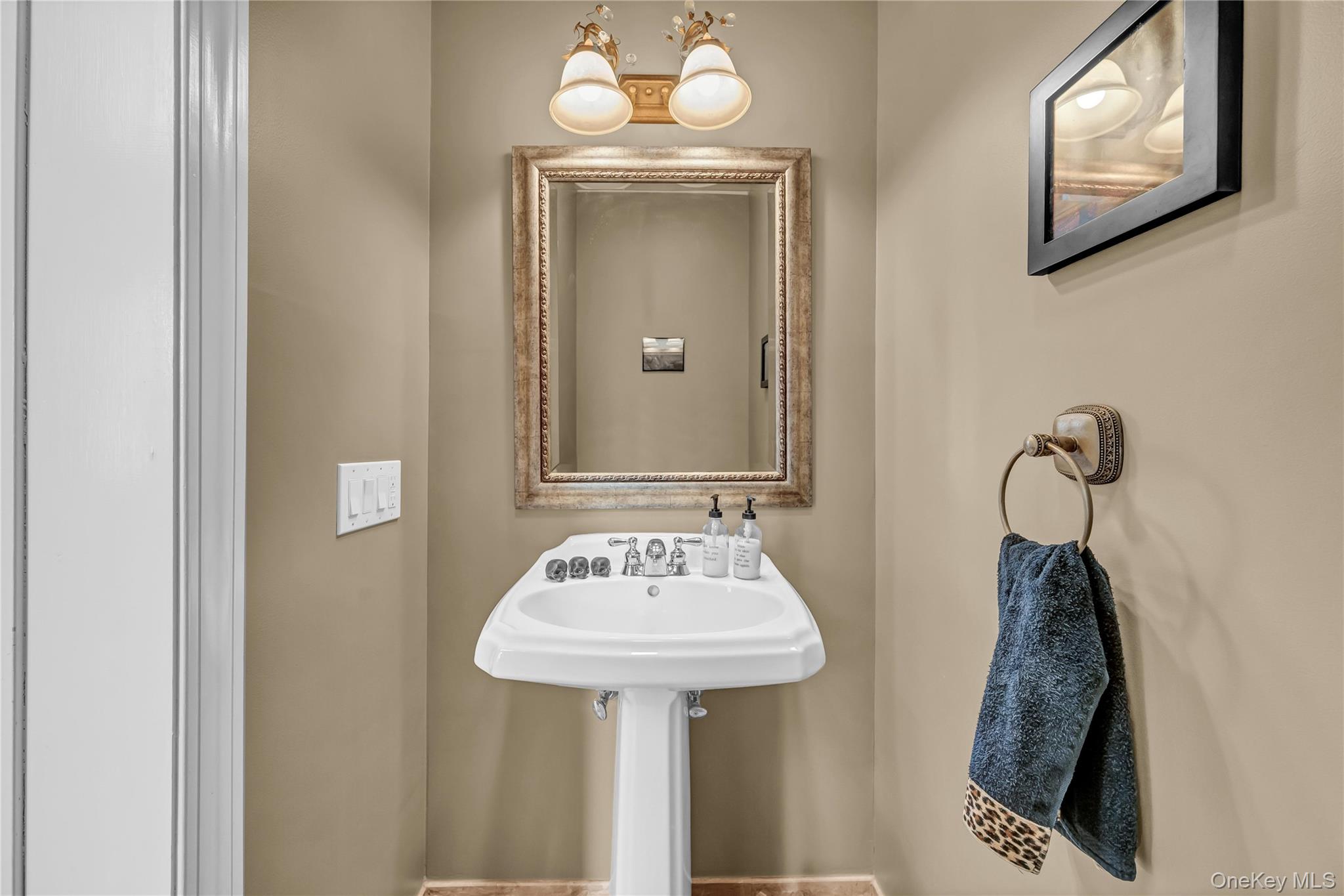 424 Gage Road Brewster, NY 10509 - Photo 7 of 42 a bathroom with a sink and a mirror