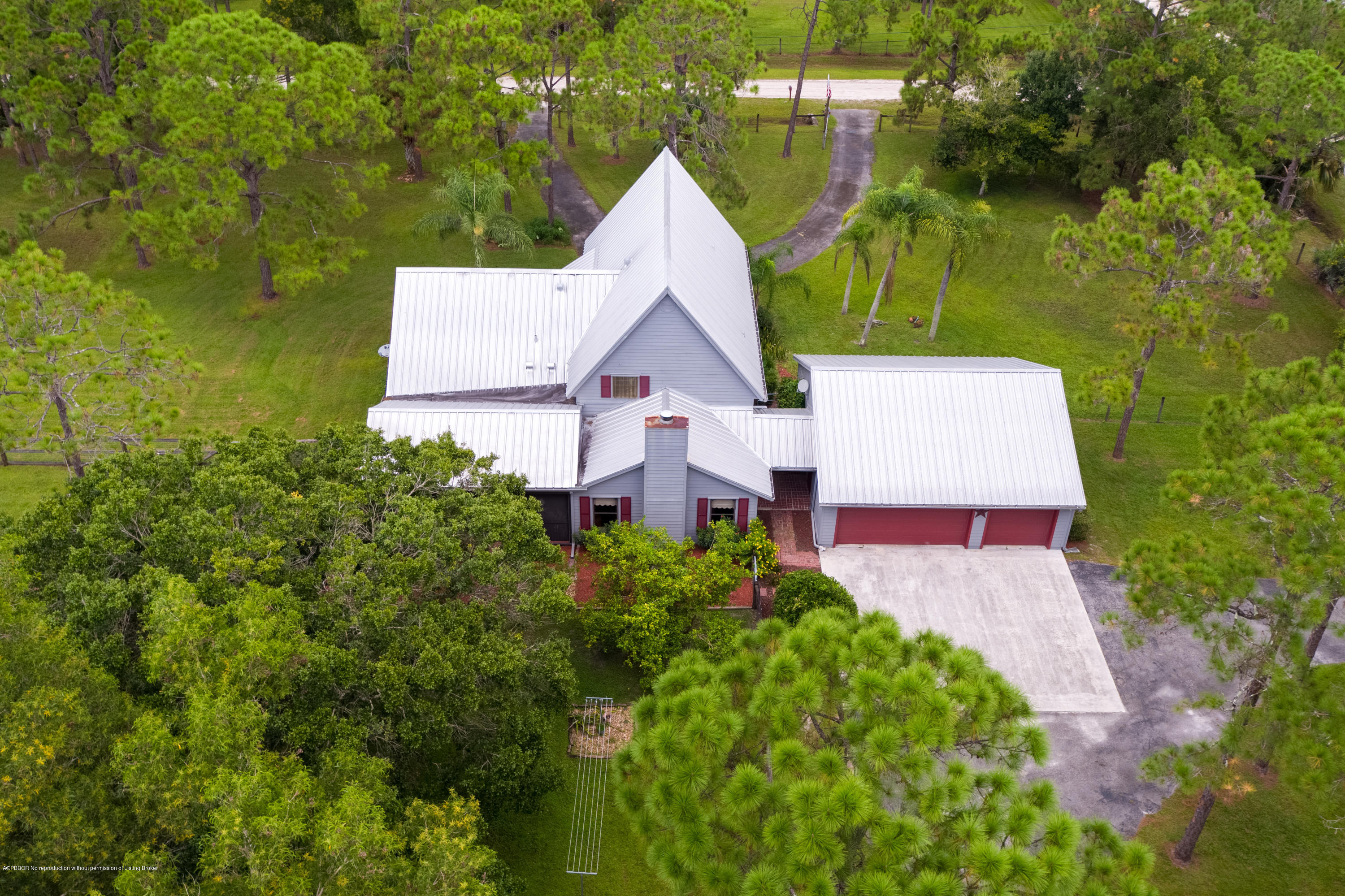 12142 157th Street North Jupiter, FL 33478 - Photo 11 of 49 a aerial view of a house with swimming pool and garden