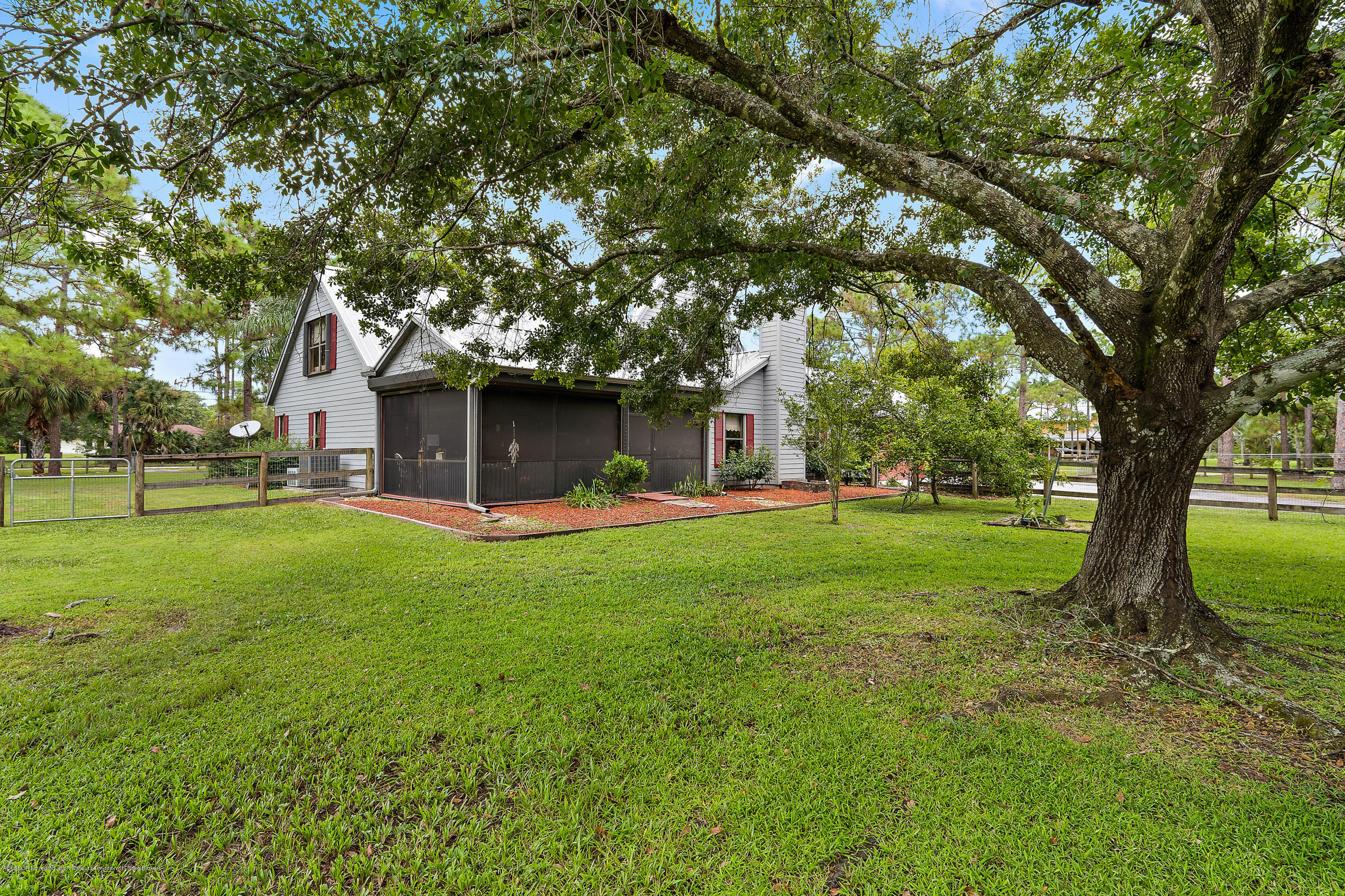 12142 157th Street North Jupiter, FL 33478 - Photo 18 of 49 a view of a house with a yard